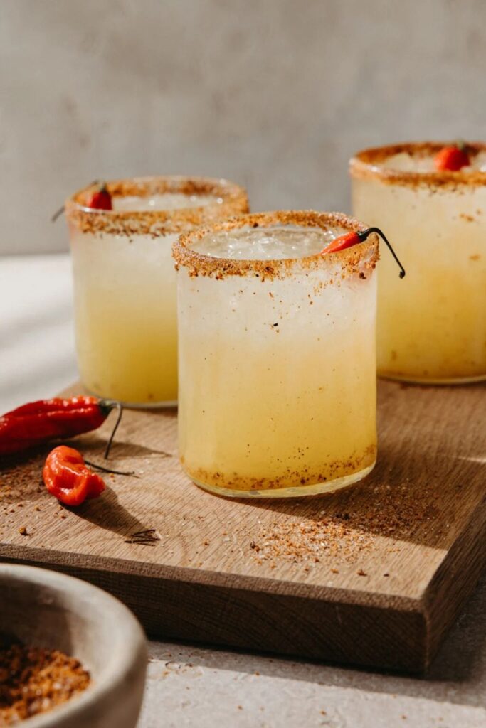 3 margarita drinks set on a wooden board for a bachelorette party